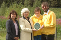 the Gold Award presented to Fiona and Neil by Patricia Ferguson (Scottish Tourism Minister) with Fiona Drane of VisitScotland